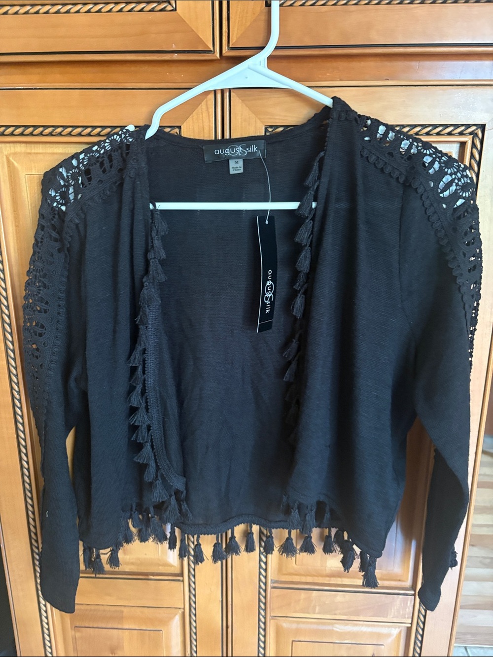 august silk Black Cropped Tassel Crochet-Shoulder Cardigan